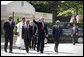 President George W. Bush walks with the Presidents from Botswana, Ghana, Namibia, Mozambique and Niger along West Executive Avenue at the White House Monday, June 13, 2005. President Bush and the African leaders met in the Oval Office before delivering a statement about AGOA to the press in the Dwight D. Eisenhower Executive Office Building. White House photo by Eric Draper