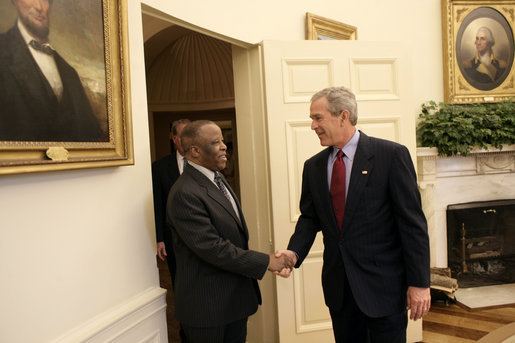 Meeting with the leaders from Mozambique, Botswana, Niger, Ghana and Namibia, President George W. Bush welcomes President Festus Mogae of Botswana to the Oval Office Monday, June 13, 2005. The leaders discussed a range of topics, including AGOA. "All the Presidents gathered here represent countries that have held democratic elections in the last year," said President Bush. "What a strong statement that these leaders have made about democracy and the importance of democracy on the continent of Africa." White House photo by Eric Draper