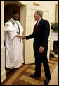 Meeting with the leaders from Mozambique, Botswana, Niger, Ghana and Namibia, President George W. Bush welcomes President Mamadou Tandja of Niger to the Oval Office Monday, June 13, 2005. The leaders discussed a range of topics, including AGOA. "All the Presidents gathered here represent countries that have held democratic elections in the last year," said President Bush. "What a strong statement that these leaders have made about democracy and the importance of democracy on the continent of Africa." White House photo by Eric Draper