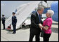 President George W. Bush talks with Freedom Corps Greeter Mickey Peters at University Park Airport in Pennsylvania Tuesday, June 14, 2005. Mickey has been a volunteer with the Centre County Cooperative Extension 4-H program for more than 40 years. White House photo by Eric Draper