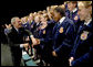 President George W. Bush greets members of the Pennsylvania FFA at their annual convention at Pennsylvania State University Tuesday, June 14, 2004. "I appreciate the fact that the Pennsylvania FFA has made a table for the Crawford, Texas FFA. I'm looking forward to telling the folks there at Crawford how decent the good folks here are in Pennsylvania, said President Bush." White House photo by Eric Draper
