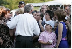 President George W. Bush meets with guests during the Congressional Picnic on the South Lawn Wednesday, June 15, 2005.  White House photo by Paul Morse