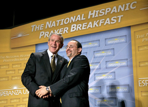 President George W. Bush is thanked by Reverend Danny Cortes after speaking at the National Hispanic Prayer Breakfast at the Andrew Mellon Auditorium in Washington, D.C., Thursday, June 16, 2005. White House photo by Eric Draper