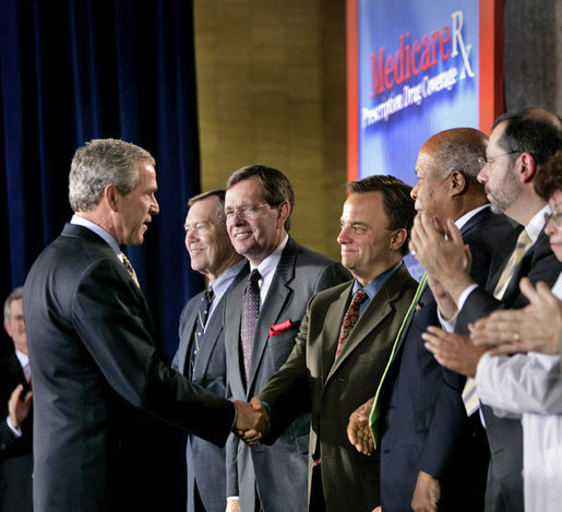 President George W. Bush greets Mark McClellan, Centers for Medicare and Medicaid Services Administrator, after speaking on Medicare at the U.S. Department of Health and Human Services Thursday, June 16, 2005. White House photo by Eric Draper