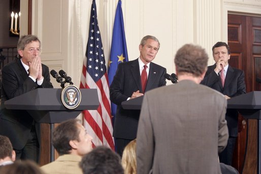 President George W. Bush is flanked by European Union President Jean-Claude Juncker, left, and European Commission President Jose Manuel Barroso as they participate in a news conference in the East Room Monday, June 20, 2005. White House photo by Paul Morse