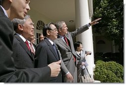 After meeting in the Oval Office, President George W. Bush shows Vietnamese Prime Minister Phan Van Khai and his delegation the Rose Garden during their visit to the White House Tuesday, June 21, 2005. It is the first visit by a Prime Minister from Vietnam in more than 30 years.  White House photo by Eric Draper