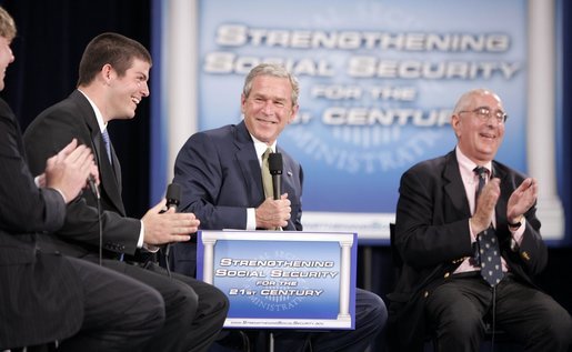 President George W. Bush shares in the on-stage laughter Thursday, June 23, 2005, as he's joined by Ben Ferguson, far left, Brian Smart, and Ben Stein during his Conversation on Strengthening Social Security at Montgomery Blair High School in Silver Spring, Maryland. White House photo by Paul Morse