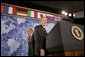 President George W. Bush stands at the podium after being introduced at the Freer Gallery in Washington D.C., Thursday, June 30, 2005, by Walter Stern, Chairman of the Board of Trustees, the Hudson Institute. The President spoke about his participation in the upcoming G8 Summit in Scotland, highlighting new initiatives to improve the quality of life of sub-Saharan Africans. White House photo by Paul Morse