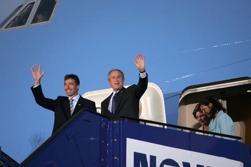 President George W. Bush and Prime Minister Anders Fogh Rasmussen wave from Air Force One upon the President's arrival to Kastrup, Denmark, Tuesday, July 5, 2005. White House photo by Krisanne Johnson