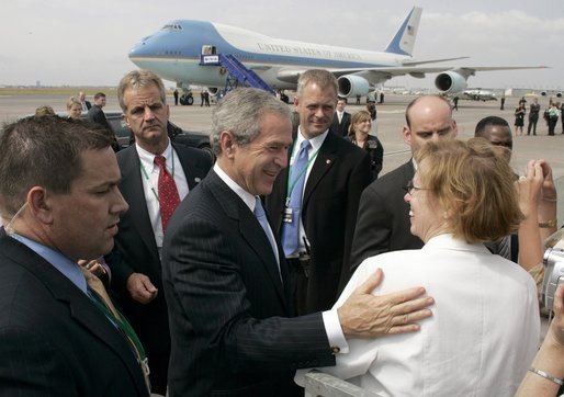 Employees and their children from the American Embassy in Denmark gather to bid farewell to President George W. Bush at Copenhagen's International Airport Wednesday, July 6, 2005. White House photo by Paul Morse