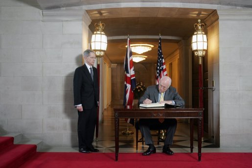 Vice President Dick Cheney signs a condolence book for the victims of Thursday's terrorist attacks in London during a meeting with British Ambassador Sir David Manning at the British Embassy in Washington D.C., Friday, July 8, 2005. White House photo by David Bohrer
