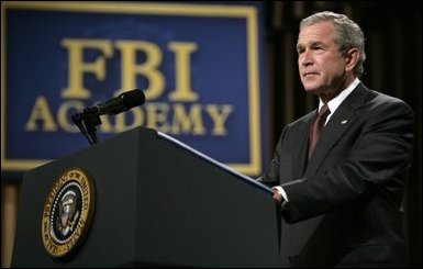 President George W. Bush delivers remarks about key accomplishments and the ongoing efforts in the war on terrorism during a visit Monday, July 11, 2005, to the FBI Academy in Quantico, Va. Said the President, "The FBI efforts are central to our success in the war on terror... And I thank you for that." White House photo by Eric Draper