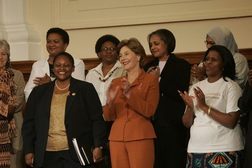 Laura Bush stands with U.S. Ambassador to South Africa Jendayi Frazer, left, during her visit to Centre for the Book, an institution established to create a culture of literacy in South Africa, Tuesday, July 12, 2005, in Cape Town. White House photo by Krisanne Johnson