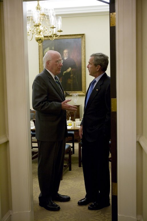 President George W. Bush confers with Senator Patrick Leahy, D-Vermont, during a breakfast meeting Tuesday, July 12, 2005, with bipartisan members of the Senate. White House photo by Eric Draper
