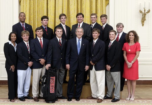 President George W. Bush stands with members of the University of Georgia Men's Golf Team during Championship Day Tuesday, July 12, 2005, at the White House. White House photo by David Bohrer