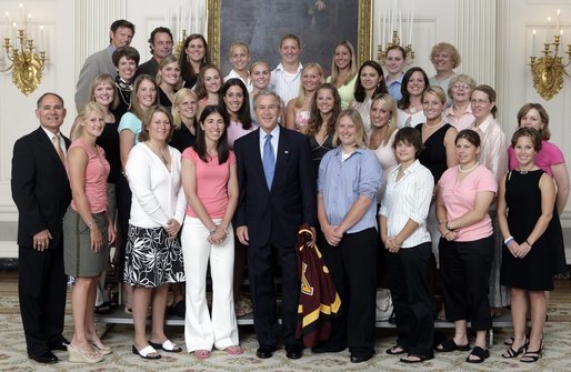 President George W. Bush stands with members of the University of Minnesota Women's Ice Hockey team during Championship Day Tuesday, July 12, 2005, at the White House. White House photo by David Bohrer