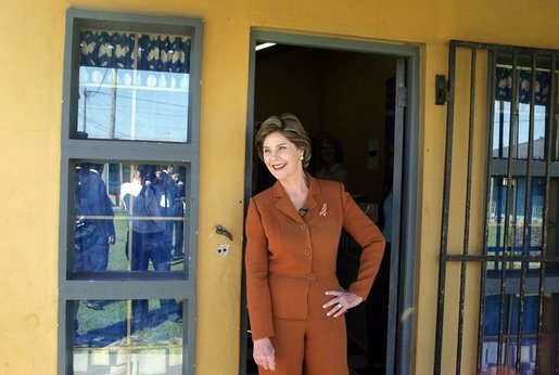 Laura Bush pauses in a doorway during an interview with Ann Curry of The Today Show at Philani, Tuesday July 12, 2005, in Cape Town, South Africa. White House photo by Krisanne Johnson