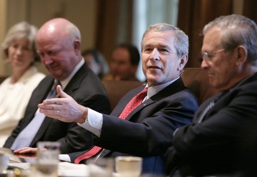 President Bush gestures as he speaks to news reporters, Wednesday, July 13, 2005, prior to the start of a cabinet meeting at the White House. From left to right are cabinet members Secretary of Interior Gale Norton, Secretary of Energy Samuel W. Bodman and Secretary of Defense Donald Rumsfeld. White House photo by Eric Draper