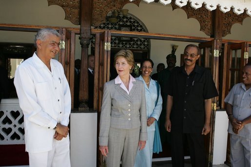 Laura Bush visits with President Amani Abeid Karume, pictured in black, at right, in Zanzibar, Tanzania, Thursday, July 14, 2005. White House photo by Krisanne Johnson