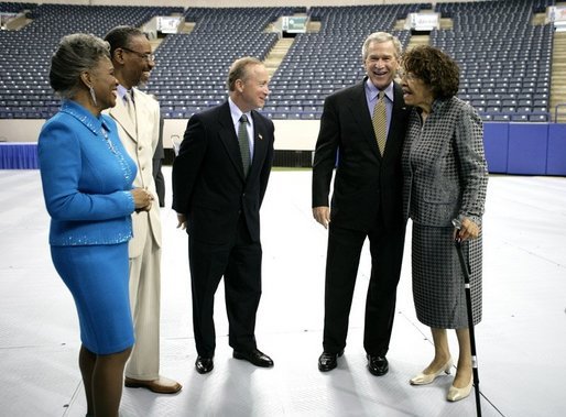 President George W. Bush is joined backstage by event participants before delivering remarks at the Indiana Black Expo Corporate Luncheon in Indianapolis, Ind., Thursday, July 14, 2005. Pictured with the President, from left are: Indiana Black Expo President Joyce Rogers, Chairman Arvis Dawson, Indiana Governor Mitch Daniels, and Congresswoman Julia Carson. White House photo by Eric Draper