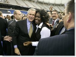 President George W. Bush greets the audience following remarks at the Indiana Black Expo Corporate Luncheon in Indianapolis, Indiana, Thursday, July 14, 2005.  White House photo by Eric Draper