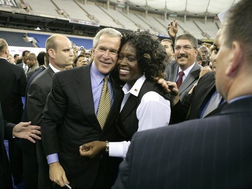 President George W. Bush greets the audience following remarks at the Indiana Black Expo Corporate Luncheon in Indianapolis, Indiana, Thursday, July 14, 2005. White House photo by Eric Draper