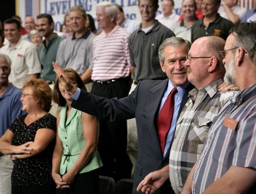President George W. Bush greets the audience after delivering remarks on CAFTA-DR at Gaston College in Dallas, N.C., Friday, July 15, 2005. White House photo by Eric Draper
