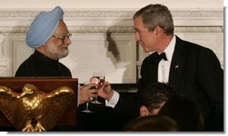 President George W. Bush and India's Prime Minister Dr. Manmohan Singh toast the evening in honor of Singh's visit, at the official dinner in the State Dining Room, Monday evening, July 18, 2005, at the White House.  White House photo by Carolyn Drake