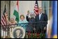 President Bush stands with India's Prime Minister Dr. Manmohan Singh, Laura Bush and Singh's wife, Mrs. Gursharan Kaur, Monday, July 18, 2005 during the Prime Minister's official visit to the White House. White House photo by Krisanne Johnson