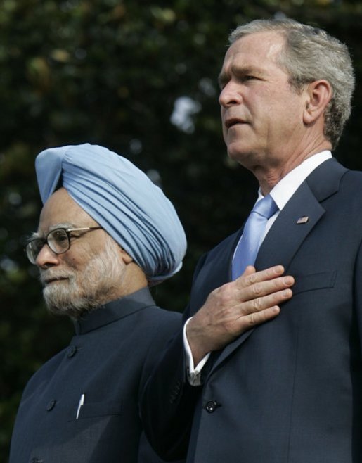 President Bush stands with India's Prime Minister Dr. Manmohan Singh, Monday, July 18, 2005 during the playing of the national anthems on the South Lawn of the White House. White House photo by Carolyn Drake
