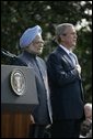 President Bush stands with India's Prime Minister Dr. Manmohan Singh, Monday, July 18, 2005 during the playing of the national anthems on the South Lawn of the White House. White House photo by Eric Draper