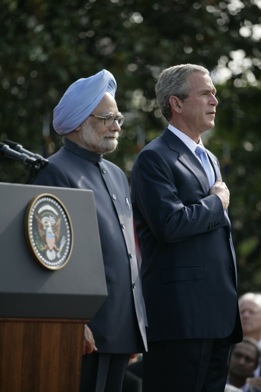 President Bush stands with India's Prime Minister Dr. Manmohan Singh, Monday, July 18, 2005 during the playing of the national anthems on the South Lawn of the White House. White House photo by Eric Draper
