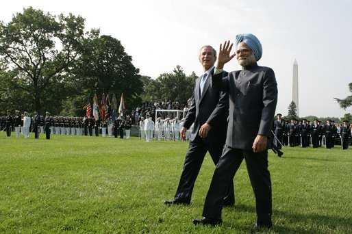 President George W. Bush walks with India's Prime Minister Dr. Manmohan Singh , Monday, July 18, 2005, on the South Lawn of the White House, during Singh's official arrival ceremony. White House photo by David Bohrer