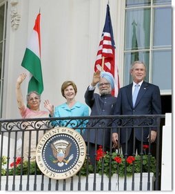 President Bush stands with India's Prime Minister Dr. Manmohan Singh, Laura Bush and Singh's wife, Mrs. Gursharan Kaur, Monday, July 18, 2005 during the Prime Minister's official visit to the White House.  White House photo by David Bohrer
