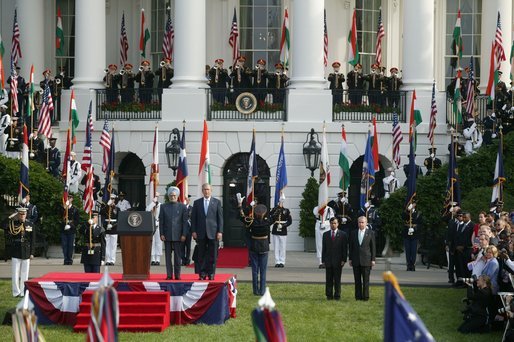 President Bush stands with India's Prime Minister Dr. Manmohan Singh in a scene of pomp and circumstance, Monday, July 18, 2005 during the playing of the national anthems on the South Lawn of the White House. White House photo by Lynden Steele