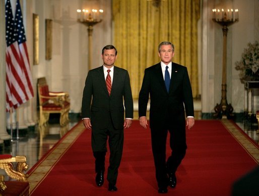 President George W. Bush walks with his Supreme Court Justice Nominee John Roberts before delivering the announcement on the State Floor of the White House, Tuesday evening, July 19, 2005. White House photo by Eric Draper