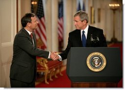 President George W. Bush shakes hands with his Supreme Court Justice Nominee John Roberts after his remarks on the State Floor of the White House, Tuesday evening, July 19, 2005.  White House photo by Eric Draper