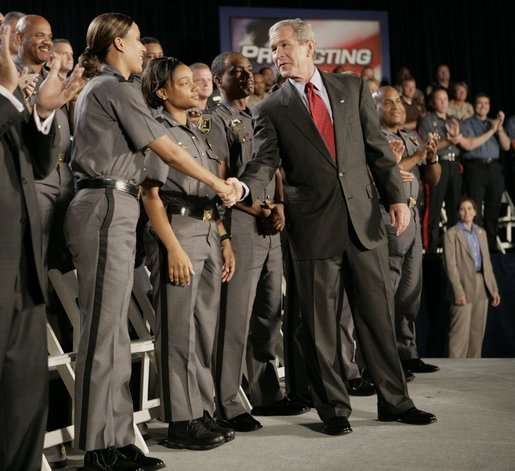 President George W. Bush meets Maryland Transportation Authority police officers, following his address to an audience Wednesday, July 20, 2005 at the Port of Baltimore in Baltimore, Md., where he encouraged renewal of Patriot Act provisions. White House photo by Eric Draper