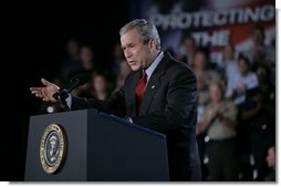 President George W. Bush gestures as he addresses an audience Wednesday, July 20, 2005 at the Port of Baltimore in Baltimore, Md., encouraging the renewal of provisions of the Patriot Act.  White House photo by Eric Draper