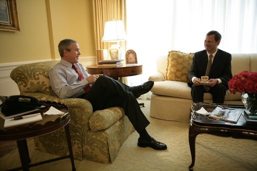 President George W. Bush and Judge John G. Roberts enjoy an early morning coffee at the residence Wednesday, July 20, 2005, in the White House. The President named Judge Roberts as his nominee to the U.S. Supreme Court Tuesday night. White House photo by Eric Draper