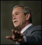 President George W. Bush gestures as he addresses the Hispanic Alliance for Free Trade, Thursday, July 21, 2005, at the Organization of American States in Washington. President Bush thanked the group for their support of CAFTA. White House photo by Eric Draper