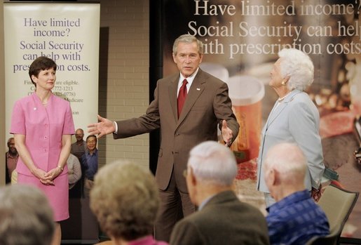 President George W. Bush appears with his mother Barbara Bush, and Medicare trainer Patty Patterson, Friday, July 22, 2005, at the Wesley Woods Center in Atlanta, to talk about new options in Medicare available to senior citizens. White House photo by Paul Morse