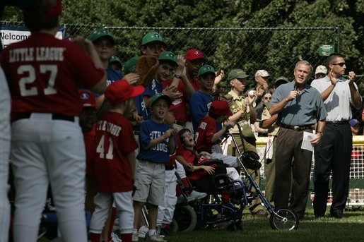 President George W. Bush welcomes players and their family members from the West University Little League Challengers from Houston, Texas, and the District 12 Little League Challengers from Williamsport, Pa., Sunday, July 24, 2005, at a Tee Ball game on the South Lawn of the White House. White House photo by Carolyn Drake