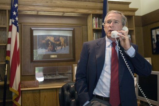 President George W. Bush offers his congratulations to Tour de France winner Lance Armstrong over the phone from this office at Camp David, Maryland. White House photo by Paul Morse