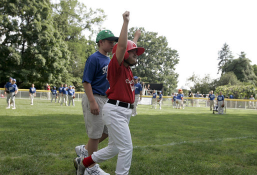 A player from the West University Little League Challengers from Houston, Texas cheers after scoring a run during a game on the South Lawn of the White House on Sunday July 24, 2005. White House photo by Paul Morse