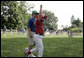 A player from the West University Little League Challengers from Houston, Texas cheers after scoring a run during a game on the South Lawn of the White House on Sunday July 24, 2005. White House photo by Paul Morse