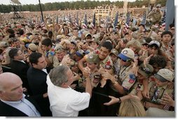 President George W. Bush greets some of the tens of thousands of Boy Scouts attending the 2005 National Scout Jamboree in Fort A.P. Hill, Va., Sunday, July 31, 2005.  White House photo by Paul Morse
