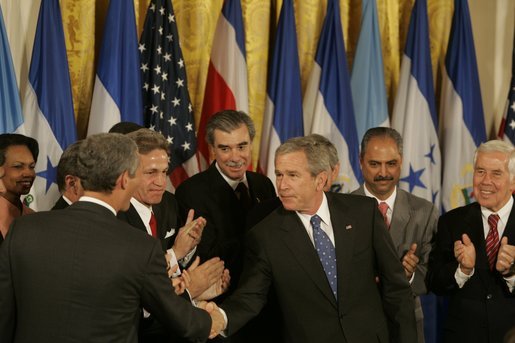 President George W. Bush shakes hands with legislators, administration officials and guests, Tuesday, Aug. 2. 2005 in the East room of the White House, after the signing ceremony for the CAFTA Implementation Act. White House photo by Krisanne Johnson