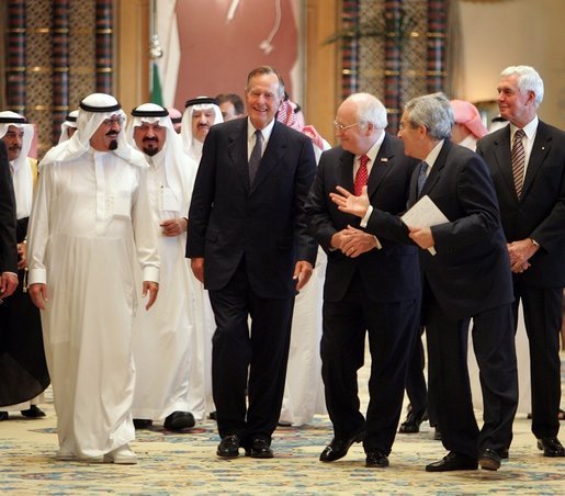 Vice President Dick Cheney and former George W. H. Bush walks with newly crowned King Abdullah during a retreat at King Abdullah's Farm in Riyadh, Saudi Arabia Friday, August 5, 2005, following the death of his half-brother King Fahd who passed away August 1, 2005. Interpreter Gamal Helal, center, is also pictured. White House photo by David Bohrer