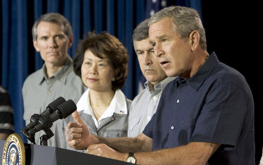 President George W. Bush addresses a news conference, Tuesday, Aug. 9, 2005 at the Bush Ranch in Crawford, Texas, following a meeting to discuss the strength of the U.S. economy. At left are economic policy advisors U.S. Trade Representative Rob Portman; U.S. Secretary of Labor Elaine Chao and U.S. Secretary of Agriculture Mike Johanns. White House photo by Paul Morse